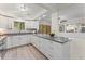 Modern, spacious kitchen features white cabinets, stainless appliances, and expansive countertops at 1088 Riverbend Club Se Dr, Atlanta, GA 30339