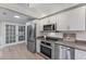 Modern kitchen featuring stainless steel appliances, white cabinets and subway tile backsplash at 1088 Riverbend Club Se Dr, Atlanta, GA 30339