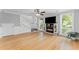 Bright living room features modern fireplace and hardwood floors at 1088 Riverbend Club Se Dr, Atlanta, GA 30339
