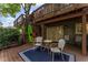 Relaxing outdoor patio with seating, a kayak, and access to upper decks at 1088 Riverbend Club Se Dr, Atlanta, GA 30339