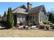 Enjoy outdoor living in this backyard with mature landscaping, patio and hardscaped lounge area at 118 Cedarcrest Village Ct, Acworth, GA 30101