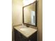 This bathroom features a single sink with a granite countertop and a large, framed mirror at 118 Cedarcrest Village Ct, Acworth, GA 30101