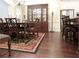 Formal dining room features hardwood floors, a large china cabinet, and an ornate rug at 118 Cedarcrest Village Ct, Acworth, GA 30101