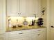 Granite countertop featuring decorations and appliances in a well appointed kitchen with white cabinetry at 118 Cedarcrest Village Ct, Acworth, GA 30101