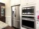 A spacious kitchen featuring stainless steel appliances including a refrigerator, microwave, and oven at 118 Cedarcrest Village Ct, Acworth, GA 30101