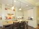 Bright kitchen featuring white cabinets, granite countertops, and a central island with seating at 118 Cedarcrest Village Ct, Acworth, GA 30101