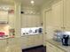 Well-appointed kitchen with granite counters, stylish white cabinetry and decor, and modern appliances at 118 Cedarcrest Village Ct, Acworth, GA 30101