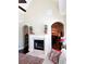 Bright living space with fireplace, open floor plan, and high ceilings, providing an airy and inviting atmosphere at 118 Cedarcrest Village Ct, Acworth, GA 30101
