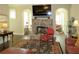 Cozy living room showcasing a stone fireplace, large TV, hardwood floors, and comfortable seating at 118 Cedarcrest Village Ct, Acworth, GA 30101