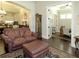 Charming living room with elegant furnishings, dark hardwood floors, and seamless flow to the kitchen and office space at 118 Cedarcrest Village Ct, Acworth, GA 30101
