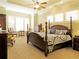 Spacious bedroom with tray ceilings, ceiling fan and a four poster bed at 118 Cedarcrest Village Ct, Acworth, GA 30101