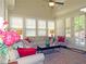 Inviting sunroom filled with natural light, featuring multiple windows, comfortable seating, and neutral walls at 118 Cedarcrest Village Ct, Acworth, GA 30101