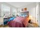 Bright bedroom featuring a cozy bed with a tufted headboard and charming decor at 2018 Manchester Ne St, Atlanta, GA 30324