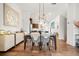 Elegant dining room featuring modern lighting, hardwood floors, and seamless flow into the kitchen at 2018 Manchester Ne St, Atlanta, GA 30324