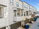Modern townhome exteriors featuring private screened-in balconies and sleek design at 2018 Manchester Ne St, Atlanta, GA 30324