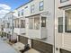 Row of modern townhomes with private balconies and covered parking garages at 2018 Manchester Ne St, Atlanta, GA 30324