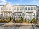 Charming townhomes featuring landscaped front yards, classic architectural details and inviting entryway at 2018 Manchester Ne St, Atlanta, GA 30324
