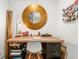 Chic home office with a stylish desk, bamboo decoration, and unique gold mirror at 2018 Manchester Ne St, Atlanta, GA 30324