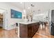 Spacious kitchen island with breakfast bar; seamlessly connects to dining and living areas in this open design at 2018 Manchester Ne St, Atlanta, GA 30324