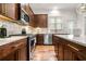 Well-equipped kitchen features stainless steel appliances, ample counter space, and dark wood cabinetry at 2018 Manchester Ne St, Atlanta, GA 30324