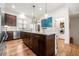 Stylish kitchen featuring a central island, stainless steel appliances, and marble backsplash at 2018 Manchester Ne St, Atlanta, GA 30324