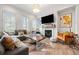 Comfortable living room featuring hardwood floors, fireplace, stylish decor, and ample seating at 2018 Manchester Ne St, Atlanta, GA 30324