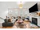 Inviting living room with a fireplace, TV, hardwood floors and large windows providing natural light at 2018 Manchester Ne St, Atlanta, GA 30324