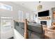 Inviting living room with a fireplace, TV, hardwood floors and large windows providing natural light at 2018 Manchester Ne St, Atlanta, GA 30324