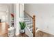 Bright staircase featuring wood stairs, white risers, wooden handrail, and decorative accents at 2018 Manchester Ne St, Atlanta, GA 30324