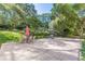 Expansive backyard featuring a large patio, outdoor dining set, and lush landscaping for outdoor enjoyment at 2965 Pharr Court South Nw # 518, Atlanta, GA 30305