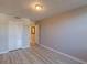 Neutral bedroom features wood-look floors, closet, and an open doorway at 2965 Pharr Court South Nw # 518, Atlanta, GA 30305