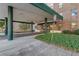 Building entryway featuring a covered area with lush landscaping and easy access at 2965 Pharr Court South Nw # 518, Atlanta, GA 30305