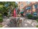 Outdoor patio with tables, chairs, and a colorful umbrella for comfortable gathering at 2965 Pharr Court South Nw # 518, Atlanta, GA 30305