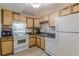 Modern kitchen with stainless steel appliances and light wood cabinets at 2965 Pharr Court South Nw # 518, Atlanta, GA 30305