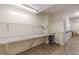 Functional laundry area with multiple machines, folding space, and storage at 2965 Pharr Court South Nw # 518, Atlanta, GA 30305