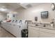 Laundry room with multiple washing machines, counter space, and sink for added convenience at 2965 Pharr Court South Nw # 518, Atlanta, GA 30305