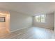 Sunlit living room featuring modern flooring and a large window with scenic outdoor views at 2965 Pharr Court South Nw # 518, Atlanta, GA 30305