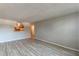 Bright living room showcasing modern flooring and an open view to the kitchen area at 2965 Pharr Court South Nw # 518, Atlanta, GA 30305