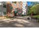 Brick building with an outdoor patio area perfect for relaxation or entertainment at 2965 Pharr Court South Nw # 518, Atlanta, GA 30305