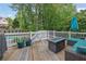 Inviting back deck with fire pit and comfortable seating, perfect for outdoor relaxation at 269 Hidden Wood Ct, Lawrenceville, GA 30043