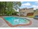 Inviting backyard with sparkling pool and elegant lounge bed, perfect for relaxation at 269 Hidden Wood Ct, Lawrenceville, GA 30043