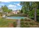 Beautiful backyard features a luxurious pool and manicured landscaping for outdoor enjoyment at 269 Hidden Wood Ct, Lawrenceville, GA 30043