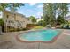Backyard oasis with sparkling pool, manicured lawn, and elegant outdoor furniture at 269 Hidden Wood Ct, Lawrenceville, GA 30043