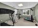 A basement fitness center with treadmill, exercise bike, and rowing machine for workouts at 269 Hidden Wood Ct, Lawrenceville, GA 30043
