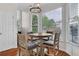 Bright breakfast nook with a modern chandelier and a lovely view of the neighborhood at 269 Hidden Wood Ct, Lawrenceville, GA 30043