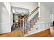 Beautiful foyer with a hardwood floor and a staircase with carpeted steps and wooden handrail at 269 Hidden Wood Ct, Lawrenceville, GA 30043