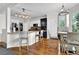 Eat-in kitchen featuring stainless appliances, granite countertops, breakfast bar, and modern lighting at 269 Hidden Wood Ct, Lawrenceville, GA 30043
