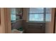 Functional bathroom featuring a window and vintage blue tiles paired with a modern mirror at 3668 Kingsboro Ne Rd # 6, Atlanta, GA 30319