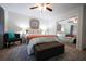 Comfortable bedroom features mirrored closet doors, patterned rug, stylish bed linens, and a cozy accent chair at 3668 Kingsboro Ne Rd # 6, Atlanta, GA 30319