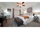 Cozy bedroom featuring a ceiling fan, patterned rug, and a comfortable bed with stylish linens and decorative pillows at 3668 Kingsboro Ne Rd # 6, Atlanta, GA 30319